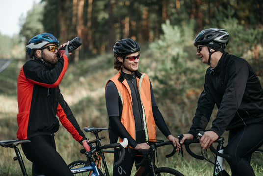 group of men wearing sunglasses on bicyles talking about sports and mountain biking