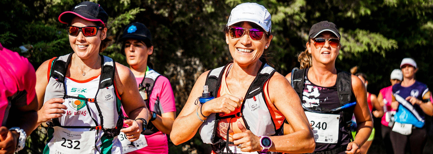 smiling women running marathon wearing mirrored sunglasses